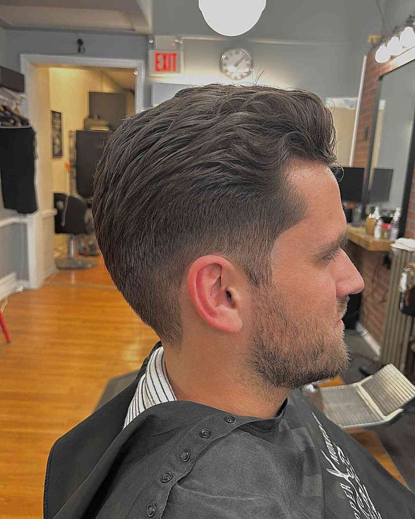 Subtle Wavy Slick Back with Low Fade